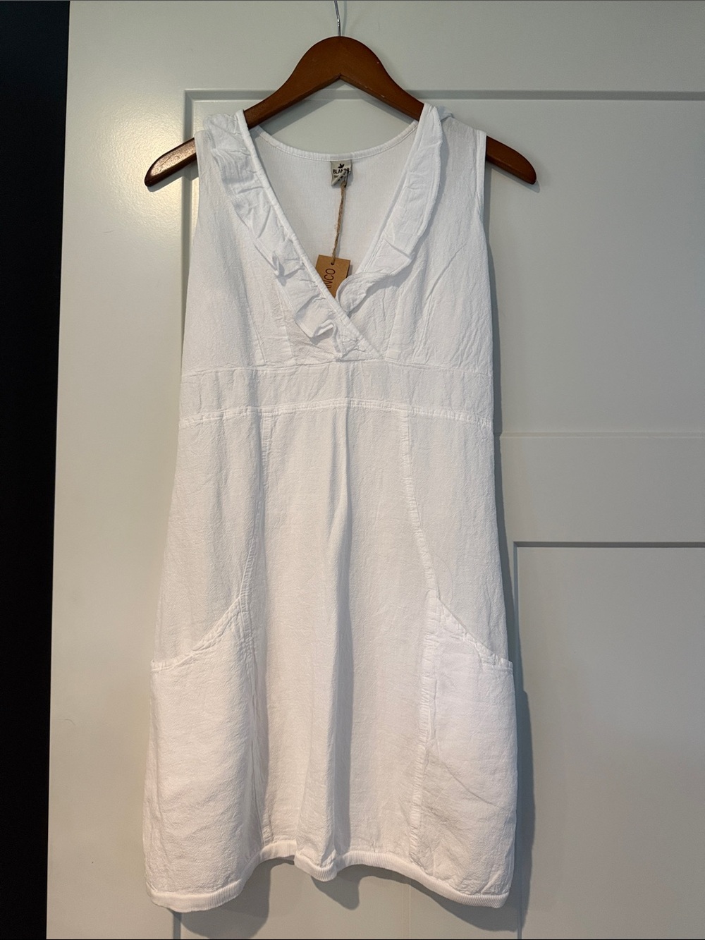Sleeveless White V-Neck Tunic Dress with Ruffle Trim